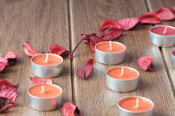 paraffin Tealight Candles and dry petals
