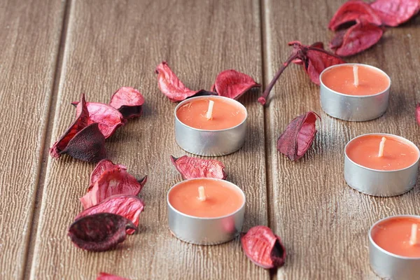 paraffin Tealight Candles and dry petals