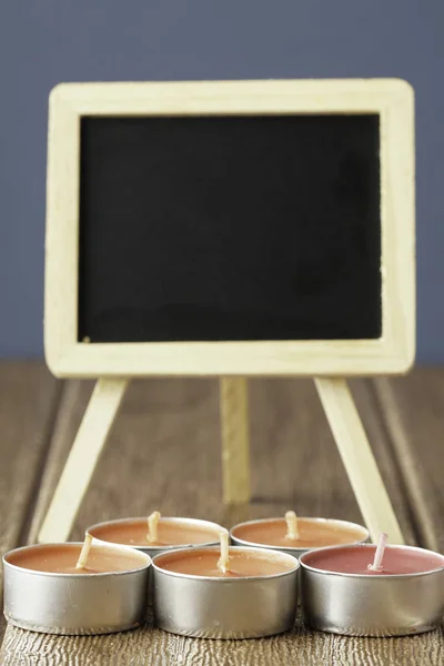 small round candles, Tealight Candles and chalk board for copy space