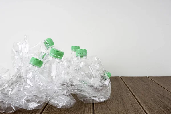 plastic bottles on wooden floor, recycling