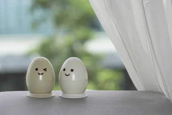 white easter eggs with funny drawn faces