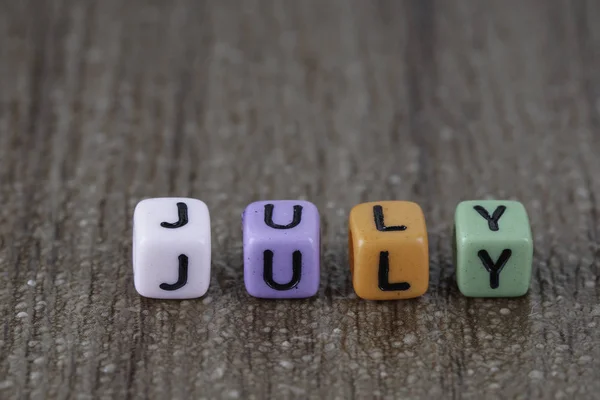 Coloridas Perlas Pequeñas Con Letras Mes Julio —  Fotos de Stock