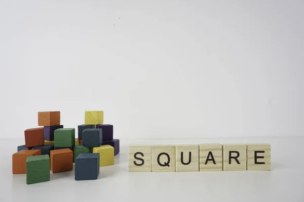 square small wooden cubes with letters