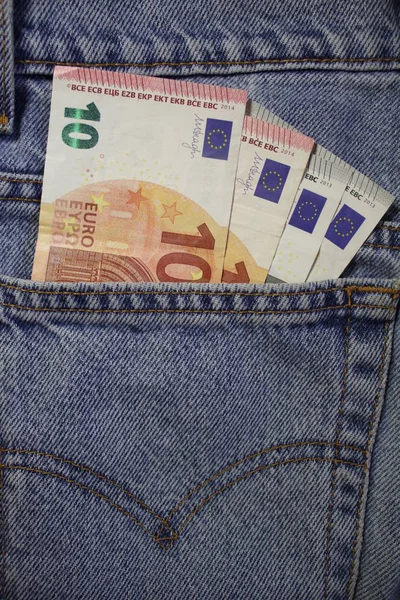 A few euro stick out of my pocket. Paper money is in a ji-pocket. Cash bills are stored in a jeans pocket. Pocket money for small expenses