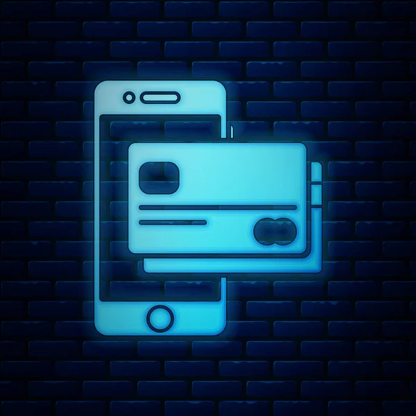 Gloeiende neon mobiele telefoon en creditcard icoon geïsoleerd op bakstenen muur achtergrond. Smartphone online betaling concept. NFC-betaling. Pictogram voor overzetten. Vector illustratie — Stockvector