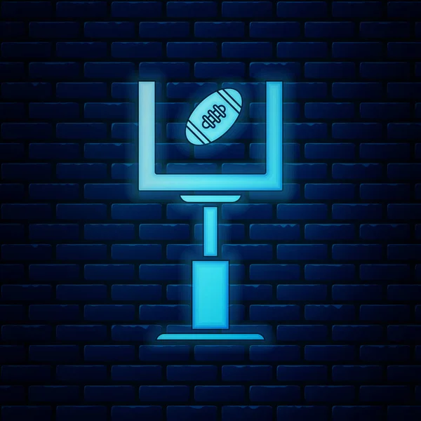 Светящийся неоновый американский футбольный пост и икона футбольного мяча изолированы на фоне кирпичной стены. Векторная миграция — стоковый вектор