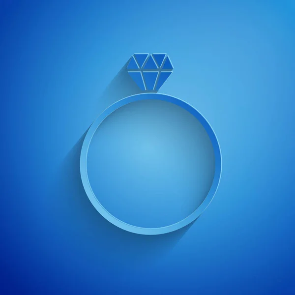 Corte de papel Icono de anillo de compromiso diamante aislado sobre fondo azul. Estilo de arte de papel. Ilustración vectorial — Vector de stock