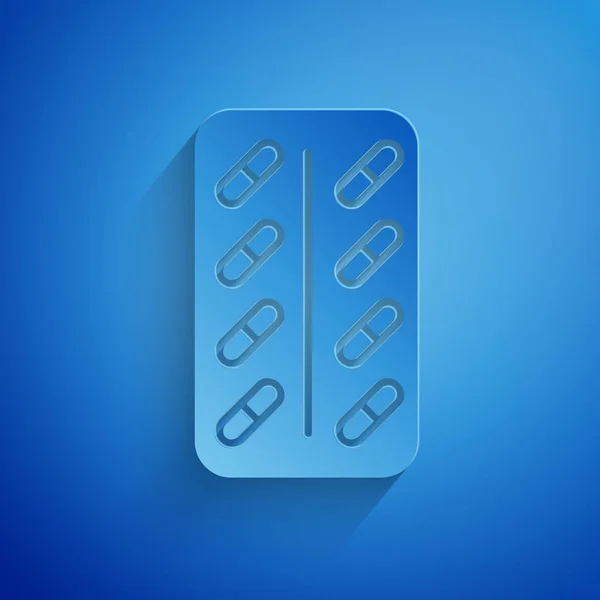 Papier gesneden pillen in blisterverpakking pictogram geïsoleerd op blauwe achtergrond. Medisch medicijn pakket voor Tablet: vitamine, antibioticum, aspirine. Papier kunststijl. Vector illustratie — Stockvector