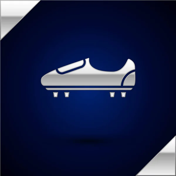 银色足球或足球鞋与尖刺图标隔离在深蓝色背景。美国足球靴。矢量插图 — 图库矢量图片