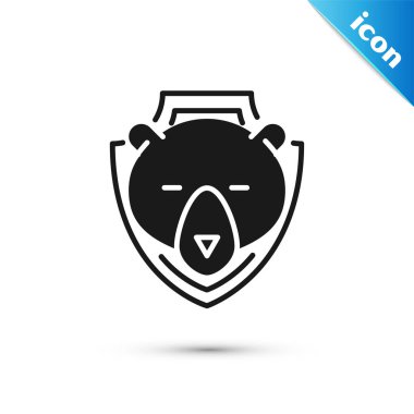 Beyaz arka planda izole kalkan simgesi üzerinde Siyah Ayı baş. Duvarda av ganimeti. Vektör İllüstrasyonu