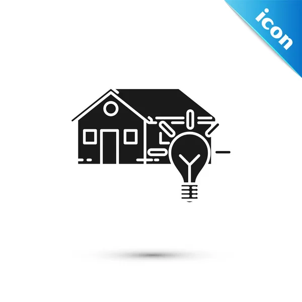 Maison intelligente noire et icône ampoule isolée sur fond blanc. Illustration vectorielle — Image vectorielle