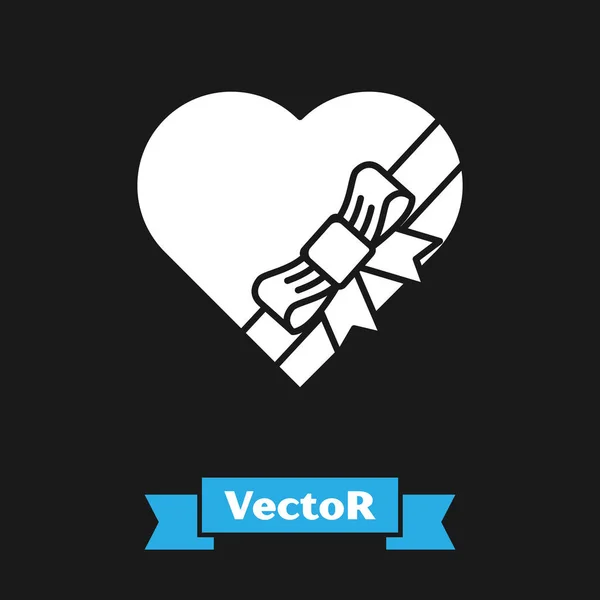 Caramelo blanco en forma de corazón caja y arco icono aislado sobre fondo negro. Día de San Valentín. Ilustración vectorial — Vector de stock