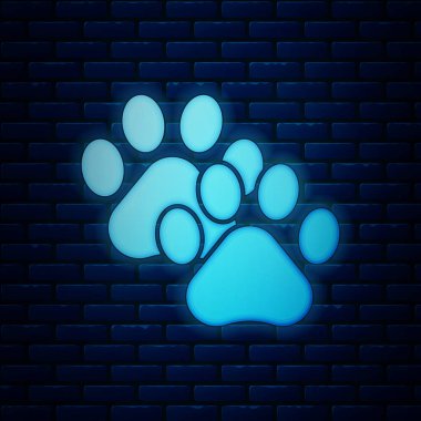 Tuğla duvar arka planda izole parlayan neon Paw baskı simgesi. Köpek ya da kedi pençesi izi. Hayvan izi. Vektör İllüstrasyonu
