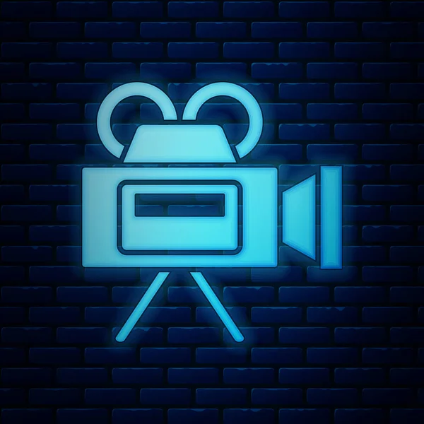 Gloeiende neon Cinema camera icoon geïsoleerd op bakstenen muur achtergrond. Videocamera. Filmbord. Filmprojector. Vector Illustratie — Stockvector