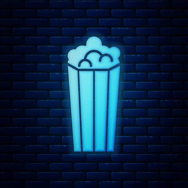 Glowing neon Popcorn in cardboard box icon isolated on brick wall background. Popcorn bucket box. Vector Illustration — Stock Vector