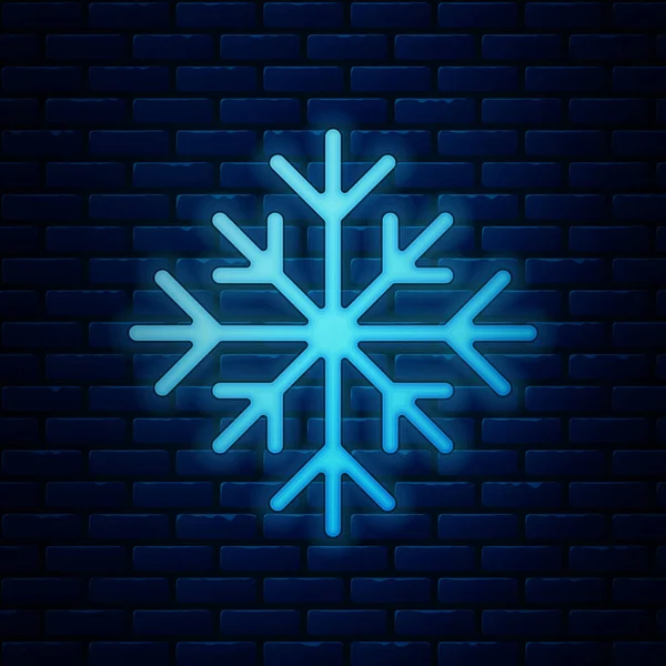 Lumineux néon icône flocon de neige isolé sur fond de mur de briques. Illustration vectorielle — Image vectorielle