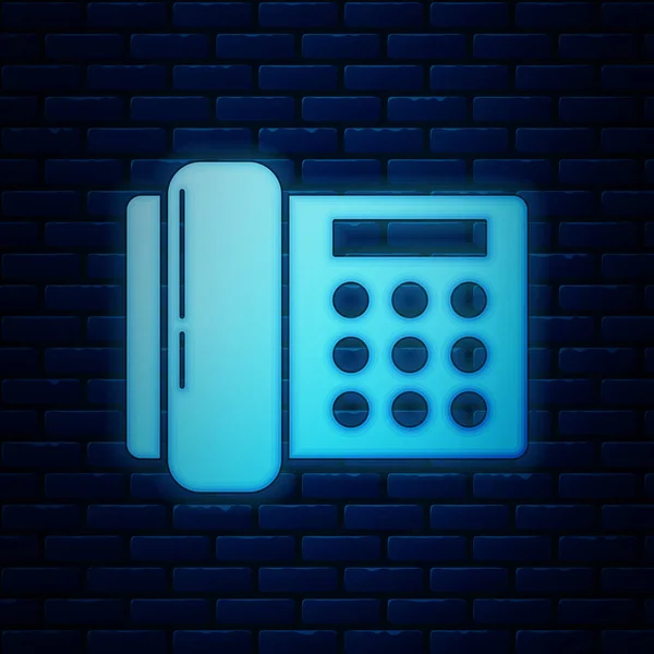 Ragyogó neon Telefon ikon elszigetelt téglafal háttér. Vezetékes telefon. Vektorillusztráció — Stock Vector