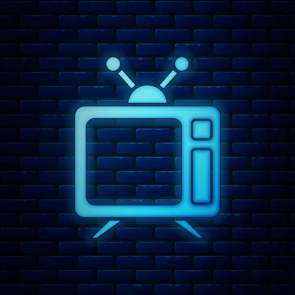 Icône de télévision néon lumineux isolé sur fond de mur de briques. Panneau de télévision. Illustration vectorielle — Image vectorielle