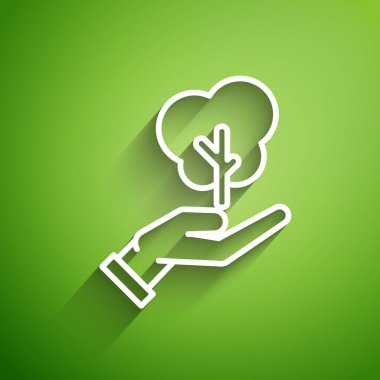 Çevre koruma ikonunun elindeki beyaz çizgi ağacı yeşil arka planda izole edilmiş. Tohum ve tohum. Fidan dikiyorum. Ekoloji konsepti. Vektör İllüstrasyonu