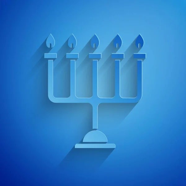 Paper cut Hanukkah menorah icon isolated on blue background. Hanukkah traditional symbol. Holiday religion, jewish festival of Lights. Paper art style. Vector Illustration — Stock Vector