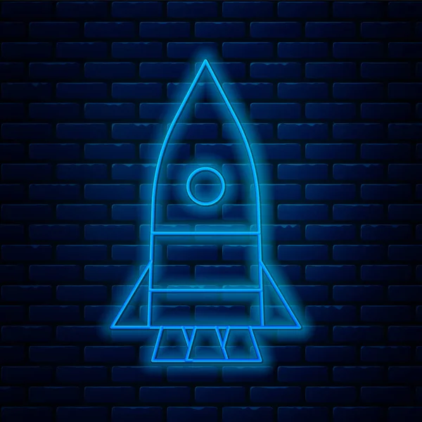 Glowing Neon Line Rocket Ship Icon Isolated Brick Wall Background — Stock Vector