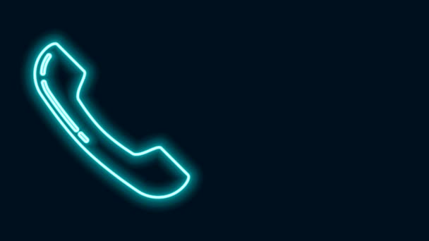 Glowing neon line Telephone handset icon isolated on black background. Phone sign. 4K Video motion graphic animation — Stock Video