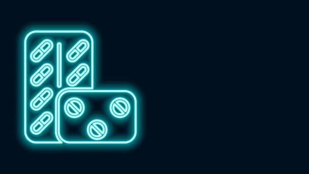 Светящиеся неоновые линии Таблетки в волдырях пакет значок изолирован на черном фоне. Пакет медикаментов для таблеток, витаминов, антибиотиков, аспирина. Видеографическая анимация 4K — стоковое видео