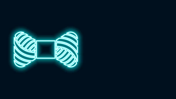 Glowing neon line Sewing thread on spool icon isolated on black background. Yarn spool. Thread bobbin. 4K Video motion graphic animation