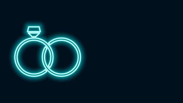 Linea neon incandescente Icona ad anelli nuziali isolata su sfondo nero. Sposa e sposo gioiello segno. Icona del matrimonio. Icona dell'anello di diamanti. Animazione grafica 4K Video motion — Video Stock
