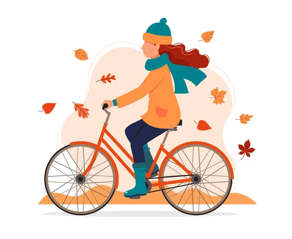 Женщина на велосипеде осенью. Векторная иллюстрация в плоском стиле — стоковый вектор
