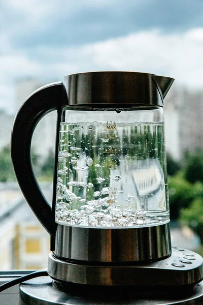 boiling water in glass kettle