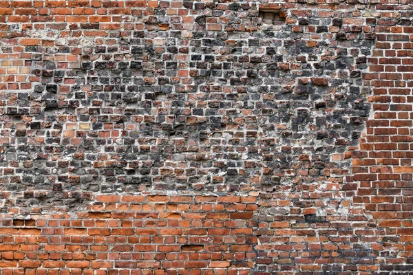 Bir sürü deseni ve rengi olan Eski Kırmızı Tuğla Duvar.