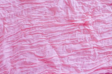 Yumuşak pembe renkli buruşmuş kumaş doku soyut arka plan