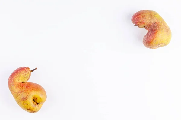 Ugly fruits organic ripe pears on white background, zero waste food concept