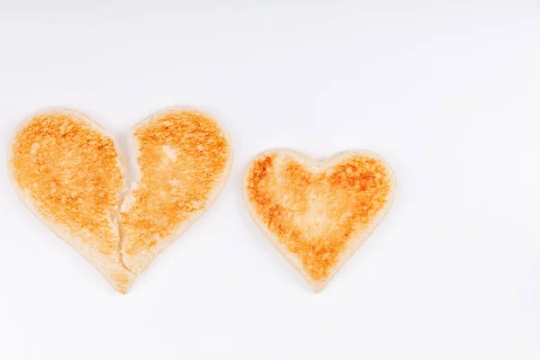 Bread toast broken heart with whole heart together on white background — Stock Photo, Image