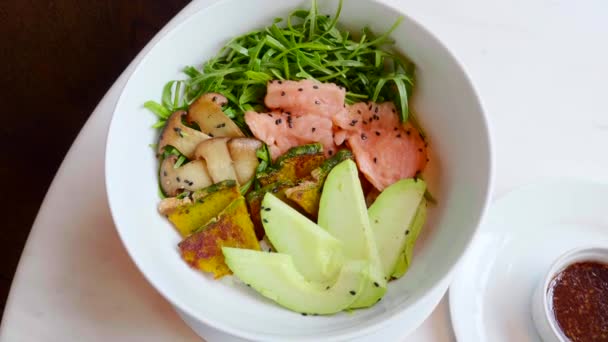 Salmon Salad with Avocado, Zucchini, Top View. Poke Bowl with Raw Fish — Stock Video