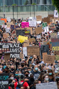 Junteenth     Protestors holding up signs during anti-racism march.   Vancouver  BC Canada    June 19th 2020 clipart