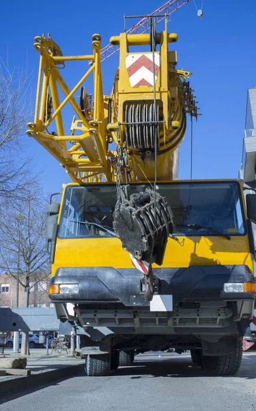 Mobile crane at construction site. Mounting crane process