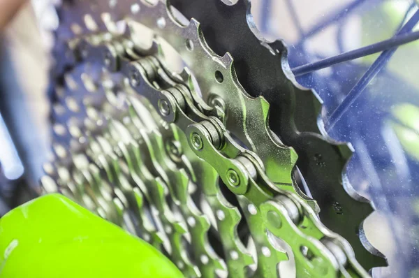 Bike chain links over chainrings on MTB. Closeup. Selectuiva focus