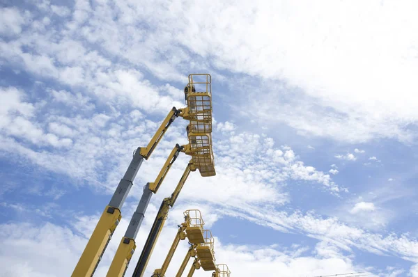 Telescopic Booms Some Platforms Lifted Blue Sky — Stock Photo, Image