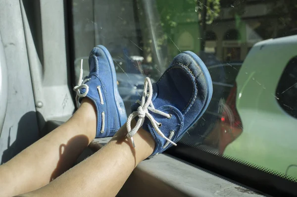 Bored little boy going by bus