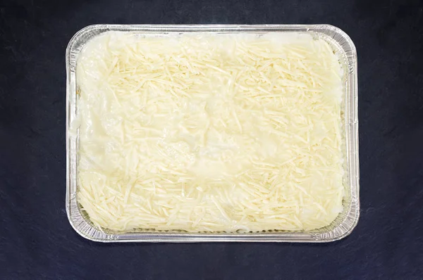 Pre-cooked cold lasagne foil tray — Stock Photo, Image
