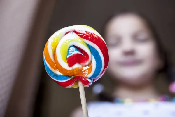 Child girl with colorful big lollipop — Stock Photo, Image