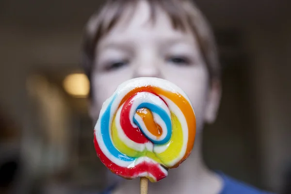 4 years old child boy wtih a colorful big lollipop — Stock Photo, Image