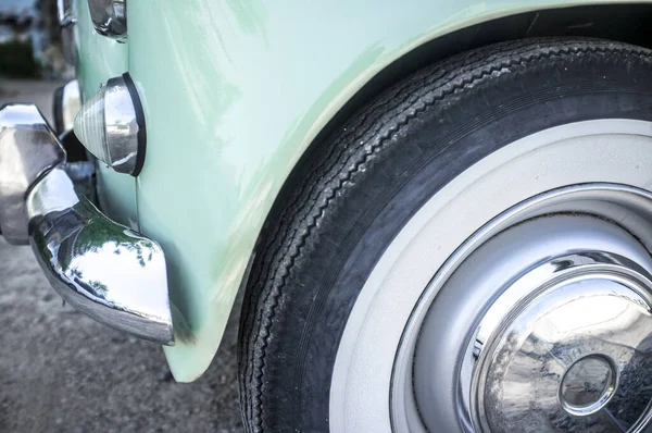 Whitewall tire mounted on restored 60s car Stock Picture
