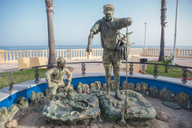 Chipiona, Spain - August 16h, 2025: Corrales de pesca fisher sculpture. JD Blanco sculpter, 2022