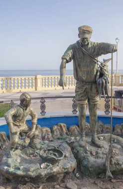 Chipiona, Spain - August 16h, 2025: Corrales de pesca fisher sculpture. JD Blanco sculpter, 2022