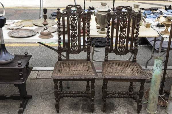 Two Antique Carved Wooden Chairs Various Items — Stock Photo, Image