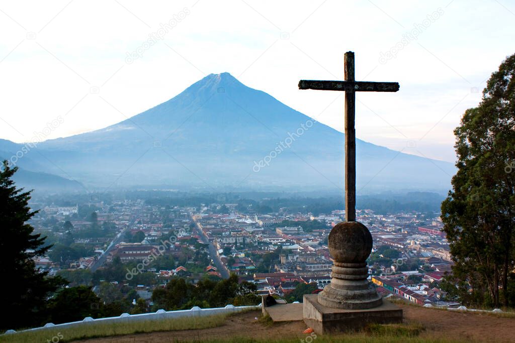 Cross over Antigua facing Agua volcano with cloudy sky, Cerro de la Cruz, Antigua Guatemala