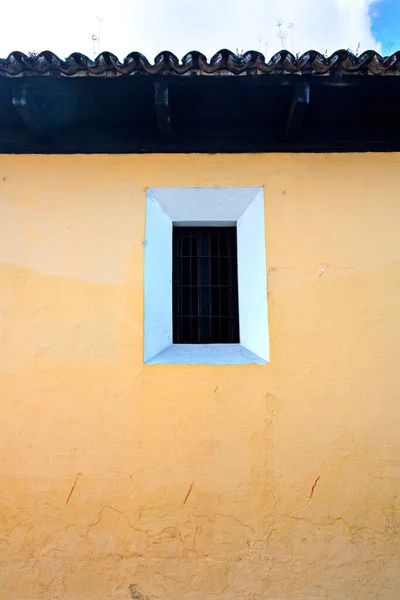 Typical colonial house exterior wall and roof and window, Antigua, Guatemala